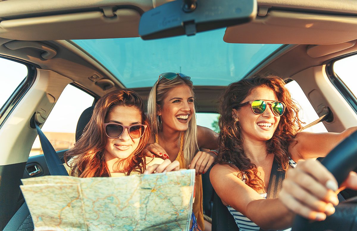 Friends on a road trip in a rental